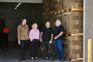 Tyron Bravo, Corinne Proske, Simon Fenech and Rob Brown in the loading bay at Fruit2Work