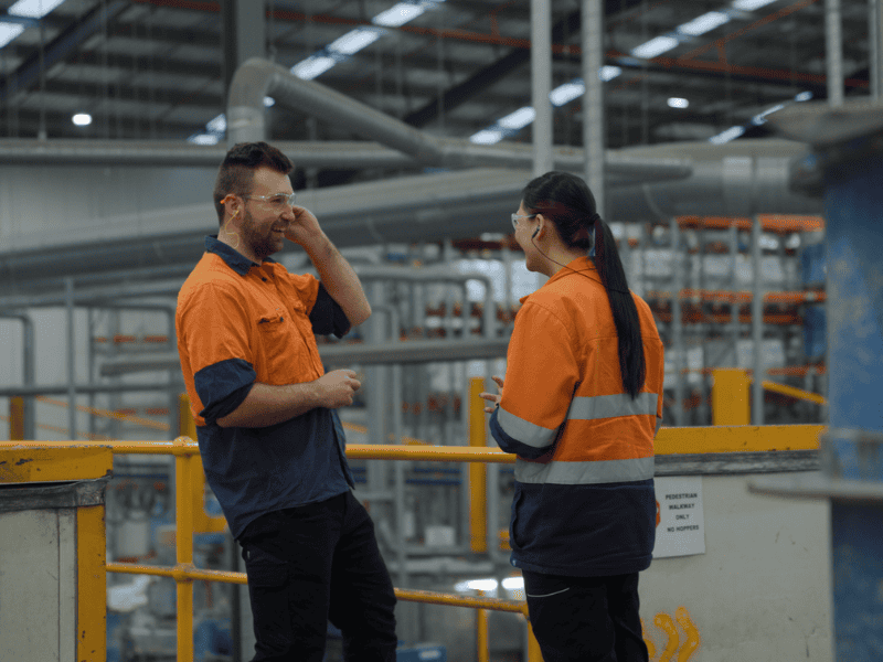 Two employees smiling
