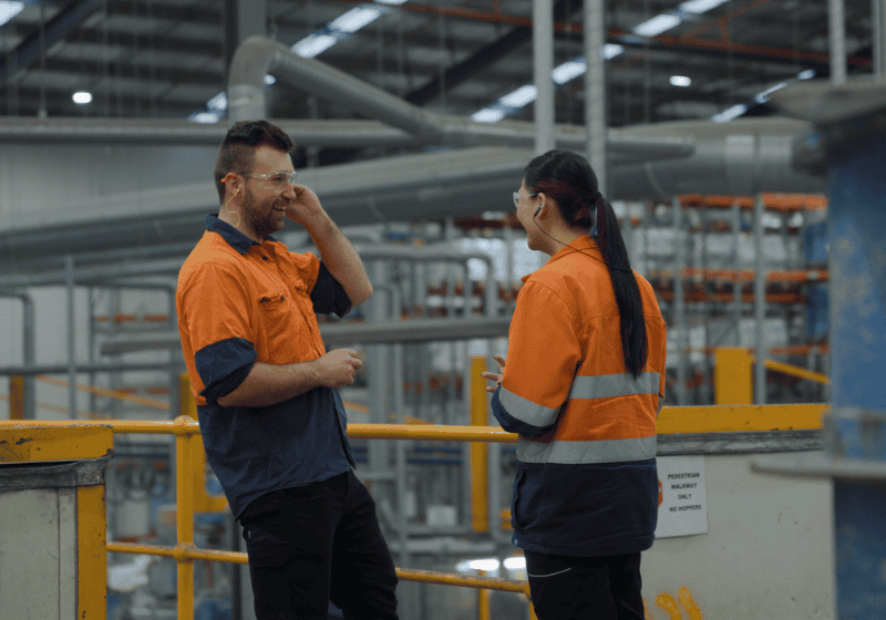 Two employees smiling