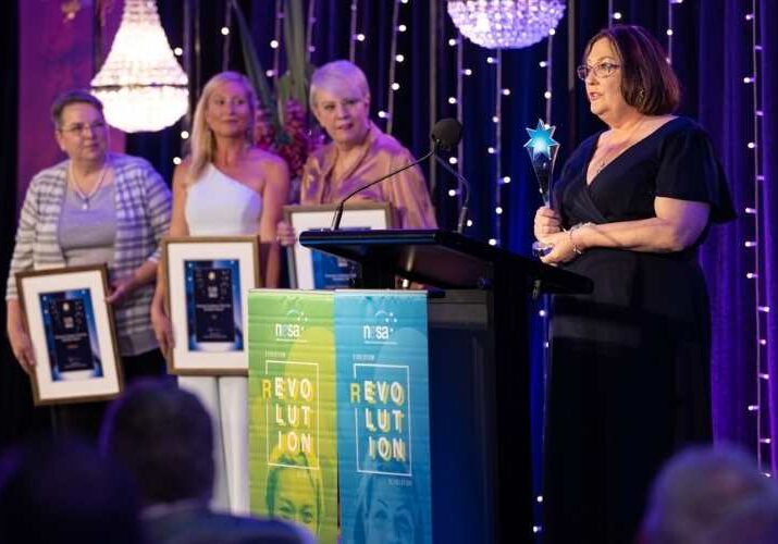 Angie’s Domestic Duties founder Angela Brown accepts her Champion Employer award. Photo: Photox